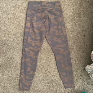 Gold and light brown camo Athleta leggings.